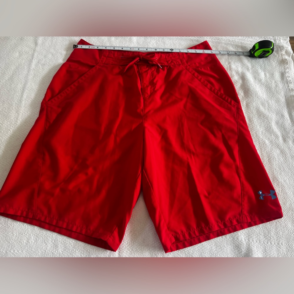 Under Armour red used board shorts in great condition size 34